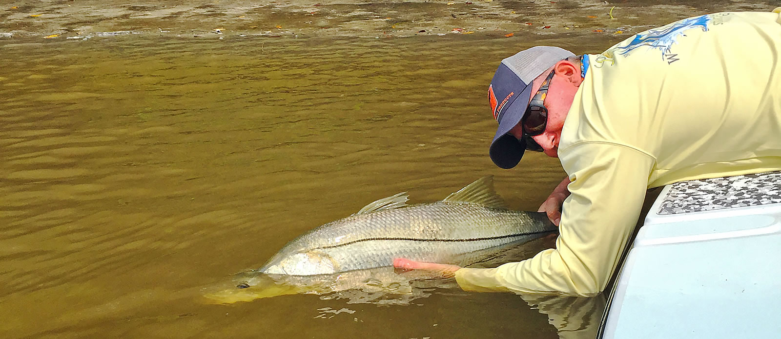 Guide Andy Thompson releasing a big snook