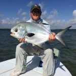Angler with caught permit